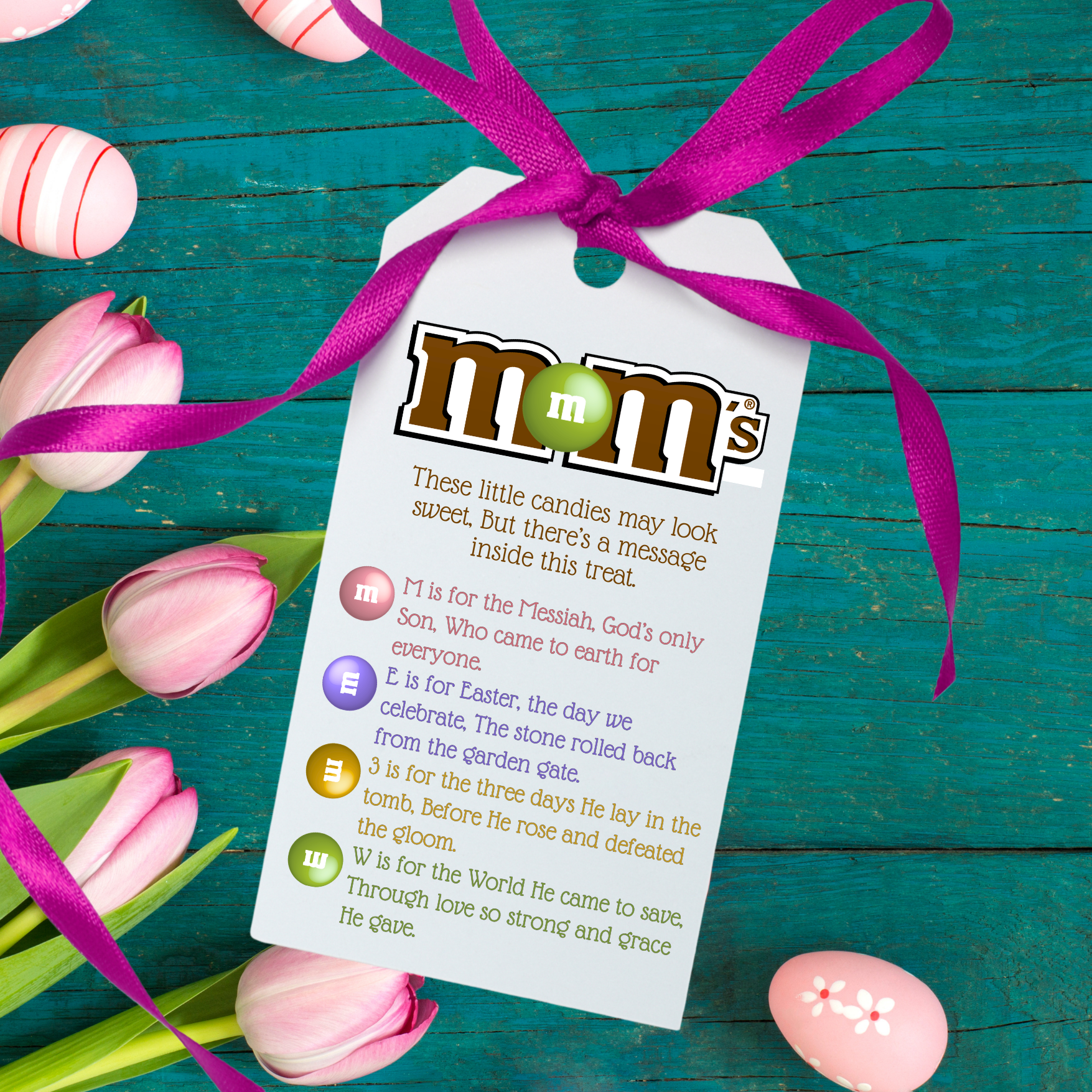 M&M's Easter candy with a tag on a teal wooden background